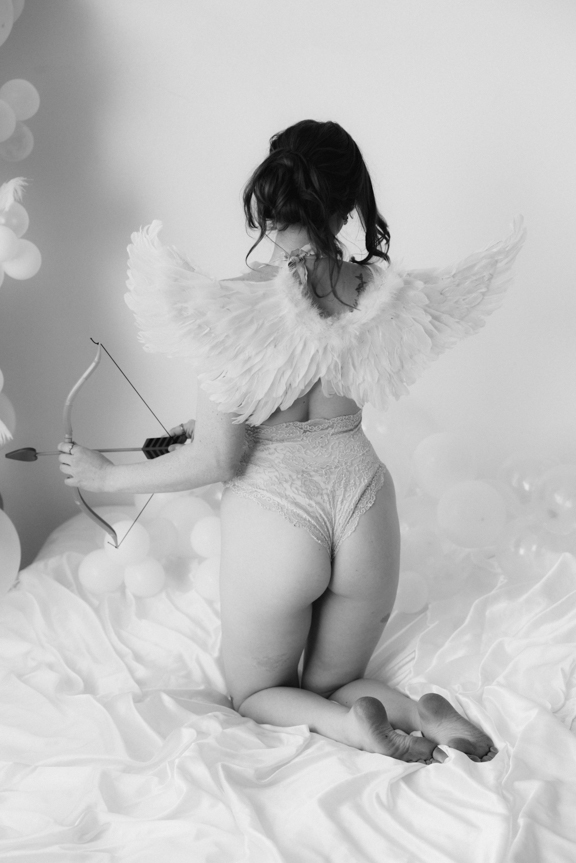 Boudoir image with cosplay angel wings