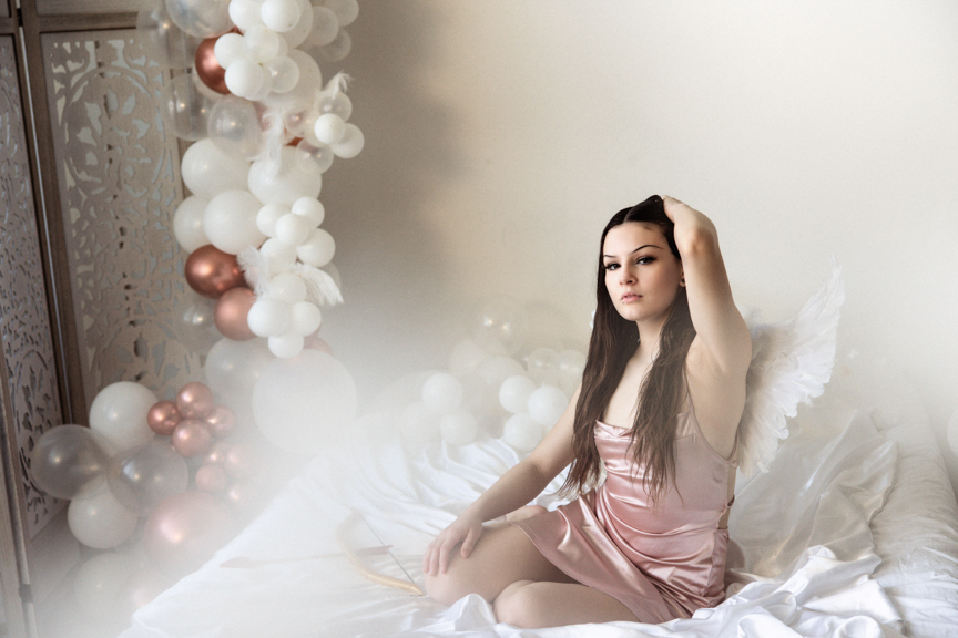 Boudoir image with cosplay angel wings