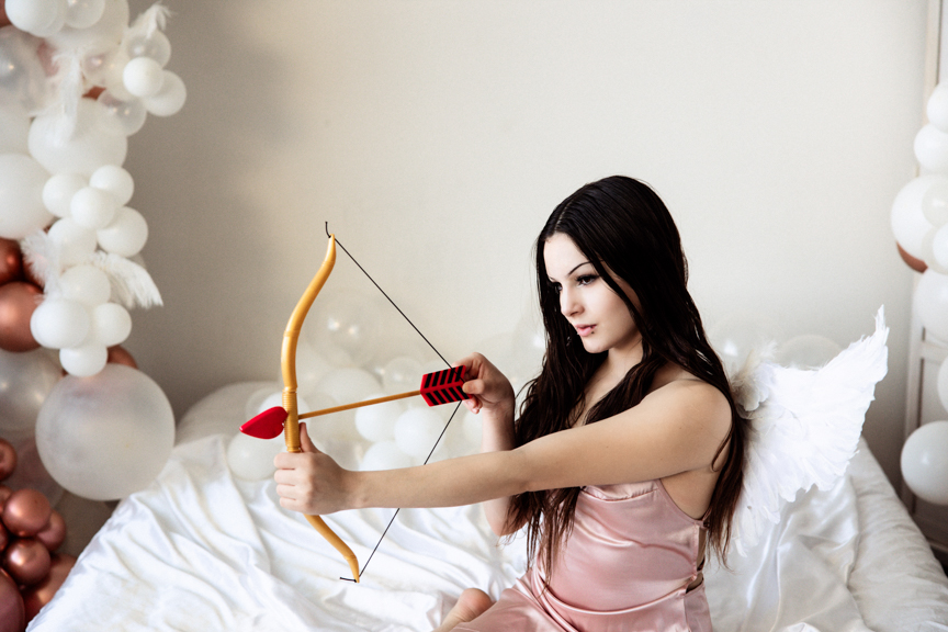 Boudoir image with cosplay angel wings