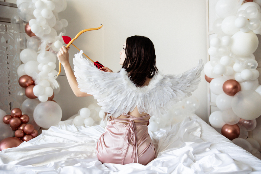 Boudoir image with cosplay angel wings