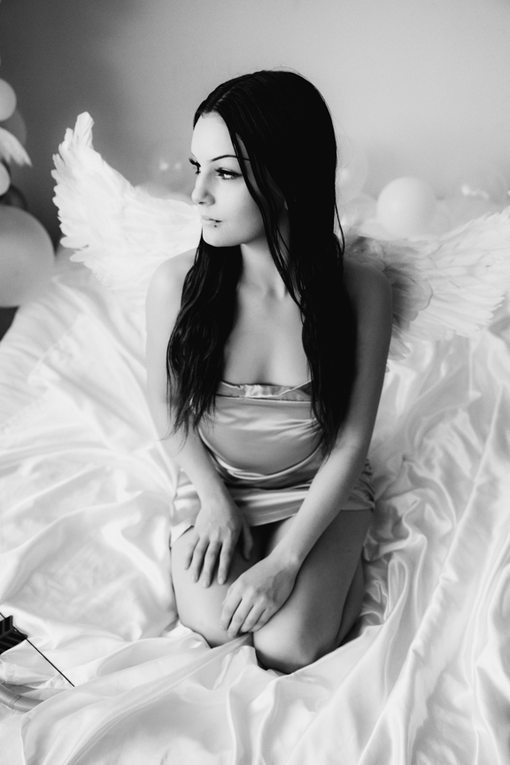 Boudoir image with cosplay angel wings