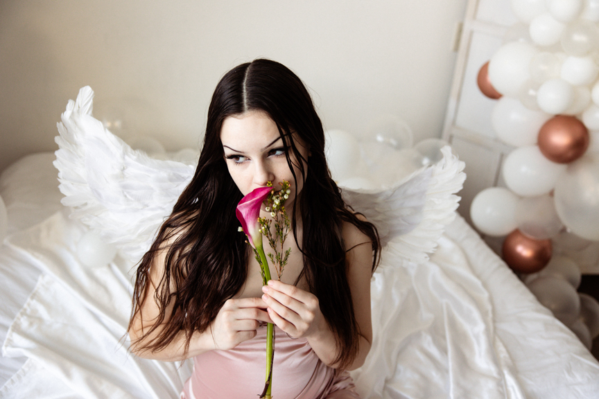 Boudoir image with cosplay angel wings