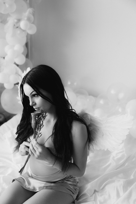 Boudoir image with cosplay angel wings